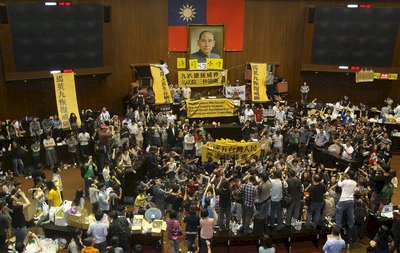 Protesters occupy legislature amid review of controversial pact