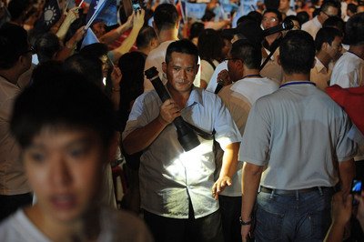 Security lapses cited after president hit by thrown book