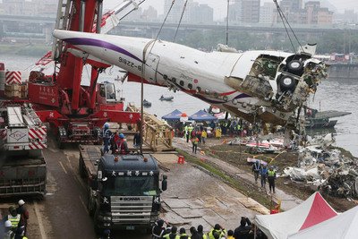 Race to find 12 missing passengers continues at crash site