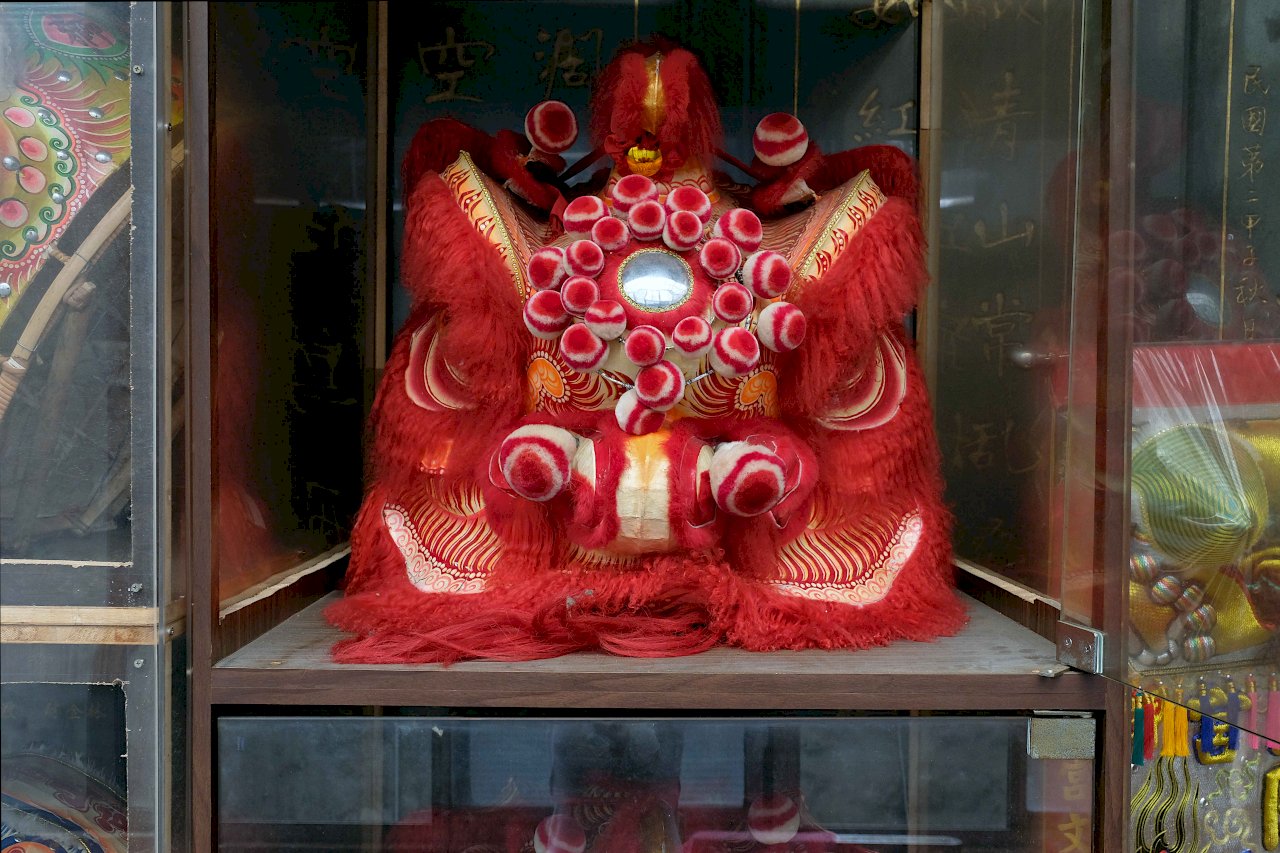 Traditional paper-mâché lion heads at the Bangka Qingshan Temple