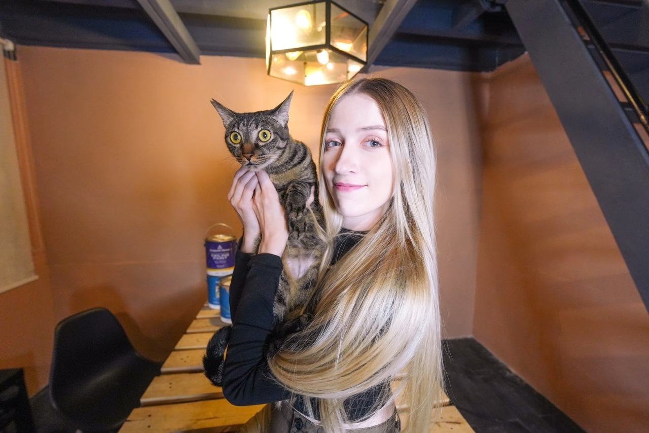 Tristan and her own captive... her cat Wang Xiang-yun. (Photo: Tristan Hildebrand)